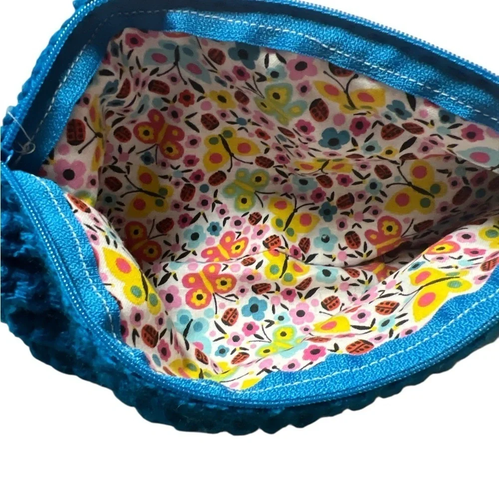 Blue Ribbed Wristlet with Butterfly Detail